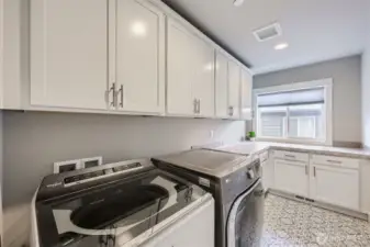 2nd Story utility room with plenty of storage space. Newer washer and dryer stay.