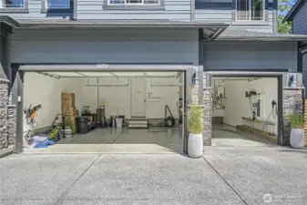 3 Car garage. 3rd bay is extra deep. Garage is fully insulated. Work bench and built-in storage. EV charger. Sprinkler system control panel.