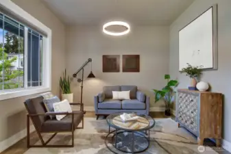 Front room can easily be a casual sitting room, a formal living room or a formal dining room. A lovely place to visit, entertain and spend holidays. Modern, centered chandelier makes this an ideal formal dining area with seating for up to 6.