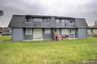 Backside with decks, patios and yard