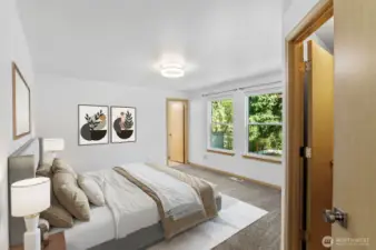 Bright and spacious retreat with plenty of room for a king bed and sitting area. (Virtually Staged )