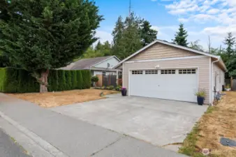 Attached garage equipped with an 11kW EV charger—perfect for eco-conscious homeowners. Offers ample storage and direct access to the home for convenience and security.