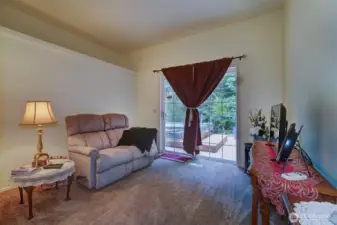 Deck, with covered hot tub, part of huge primary suite.