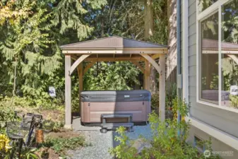 Enjoy the gazebo covered hot tub.