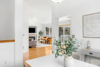 From the dining area, you can see straight through to the living room and out to the deck, showcasing the home's easy flow.