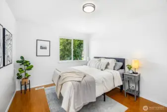 A bright and versatile upper-level bedroom.