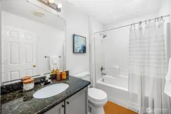 The full bathroom on the upper level serves the secondary bedrooms.