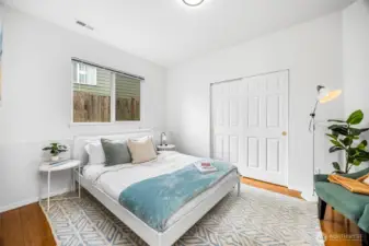 A comfortable lower-level bedroom with a roomy closet, perfect for guests or multigenerational living.