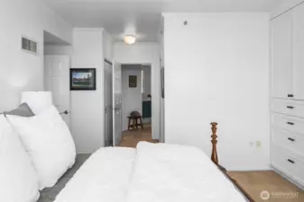 Spacious primary suite in Bellevue Pacific Tower with abundant natural light.