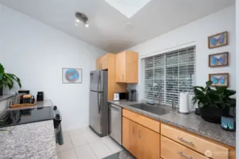 Stainless steel appliances and generous counter space make this kitchen a true chef’s delight.