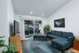 The spacious living room opens directly to your outdoor patio, creating a perfect flow for indoor-outdoor living.