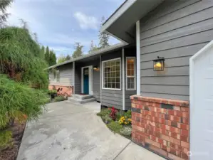 Inviting front entrance that leads you into the home or to the peaceful front yard.