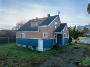 Back of house with basement entrance