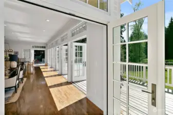 Wall of windows/French doors off the great room lead you to this backyard oasis.
