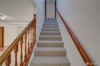 Stairway to 2 upstairs bedrooms and a full bath.