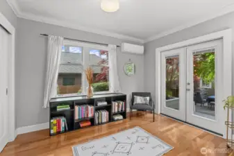 Main Floor bedroom / office.  French doors to the backyard oasis. Room also features two closet spaces.
