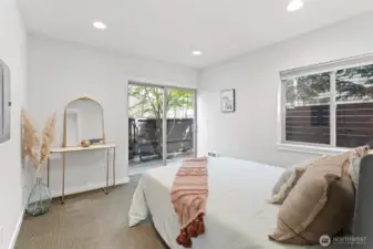 Convenient access to enclosed backyard from this entry level bedroom.
