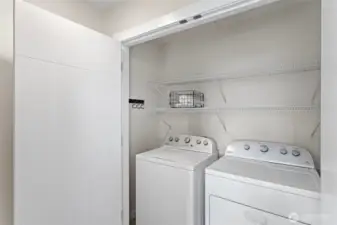 Full sized washer-dryer conveniently situated on primary suite floor