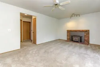 Hallway to 4th bedroom, 1/2 bath, laundry and garage