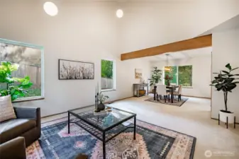 Living room is open to the formal dining space which has a fresh coat of paint and new lighting