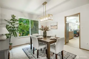 Dining room looks to the private backyard and has easy access to kitchen