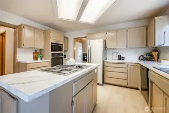 Newly updated kitchen with new appliances, countertops, flooring, and paint