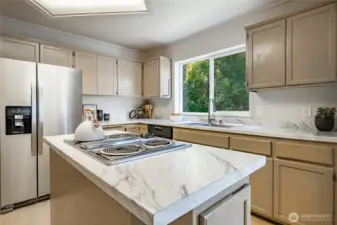 Newly updated kitchen with new appliances, countertops, flooring, and paint