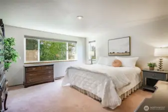 Primary Bedroom and Ensuite features fresh paint and new window to take in evening sunsets.