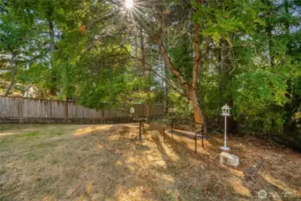 Backyard has a quiet meditation spot and is partially fenced