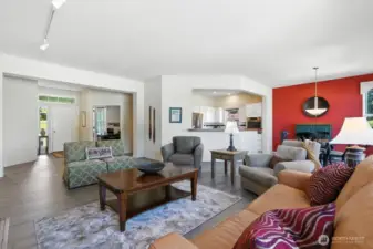 Open concept living area with a floor plan that just flows - large windows for an abundance of light throughout home! Engineered hardwood floors, gas fireplace.