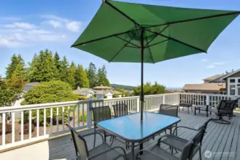 Enjoy peaceful water views of the Admiralty Inlet and mountain views from the Olympics from the large   30x15 deck