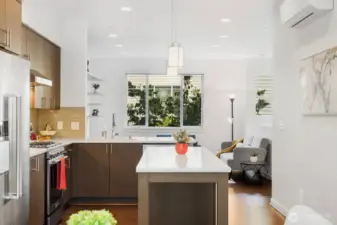 Open space from the dining room to the living room.  The kitchen is the central focus.
