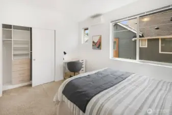 Every closet has been upgraded with California Closets' premium storage solutions.  Second bedroom features a desk nook.