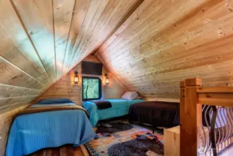 Open loft layout makes room for three beds with ease.  Windows on opposite ends.