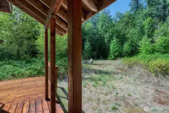 Covered outdoor space overlooks your firepit area and grounds.