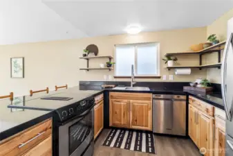 Newly renovated kitchen w/ beautiful hard wood cabinets.