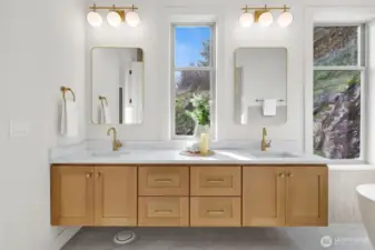 Double sinks with so much space. Note the custom floating cabinetry