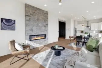 The great room is open to the hallway from the front entry