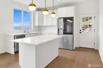 Note the kitchen downstairs (plumbed for a stove) and the man door with access to the back yard
