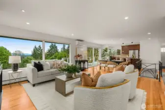 View of your Kitchen/Great Room with stunning views from the entire back of the home- especially beautiful morning sunrises!