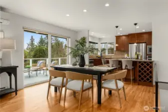 Dining area is roomy enough for a large table- access to the oversized deck offers a wonderful setting for entertaining.