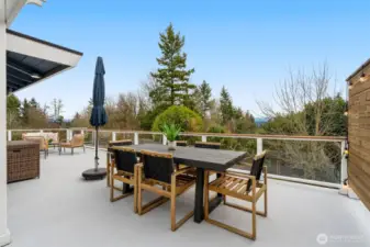 Another view of your outdoor Living and Dining Rooms, overlooking the sport court, garden, and backyard.