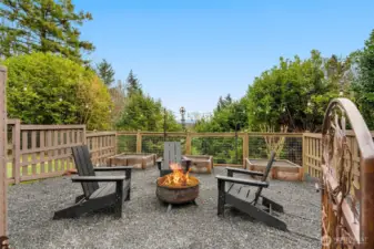 Fenced garden space keep pets and local deer out of your gardening efforts- You can easily keep things properly watered with the additional hose bib within the space. This is another space to enjoy an outdoor fire. There are also two Spartan Apple trees (one on each side of the garden)- a delicious treat to look forward to in the Fall!