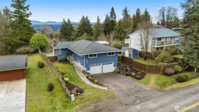 Aerial view of the front of the home, looking East towards the Cascades and sunrises.
