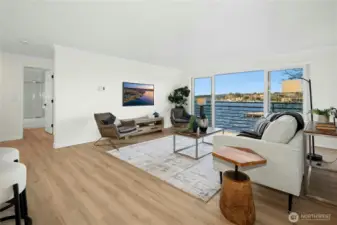 Large living room with new luxury vinyl plank flooring, new paint, and water views for days!