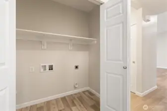 Convenient laundry room off the hallway