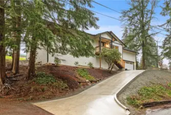Elevated setting among mature trees for a tucked-away feel.