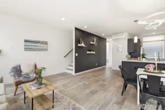 Stairs up to the rooftop deck.  That dining room fixture in the upper right is an Artemide light fixture imported from Italy.