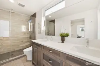The primary bath with heated tile floors.