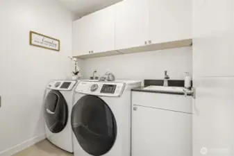 Washer & dryer in the laundry room on the 2nd level, just outside of the primary suite.